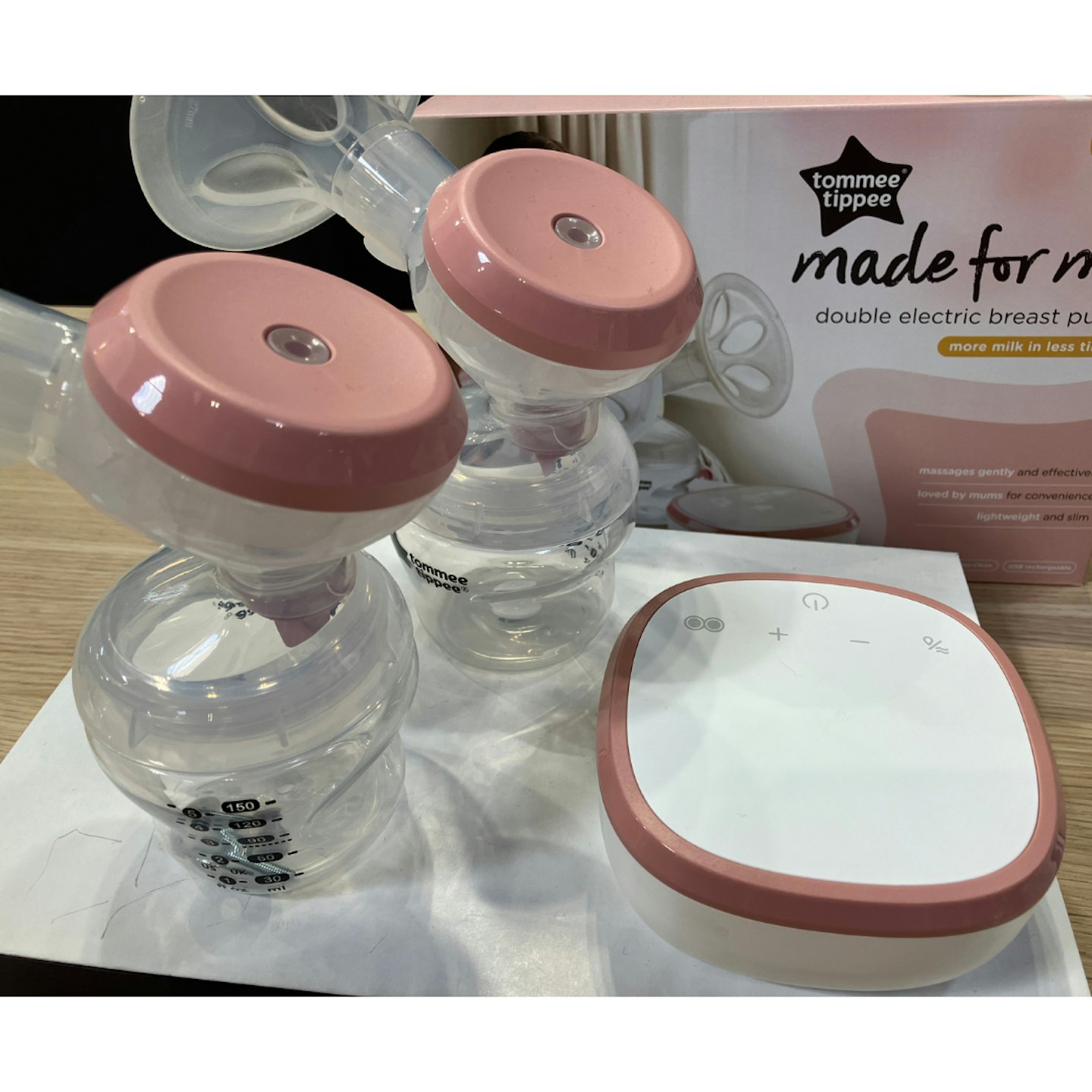Tommee Tippee Made for Me Double Electric breast pump on a kitchen counter with the parts ready to use