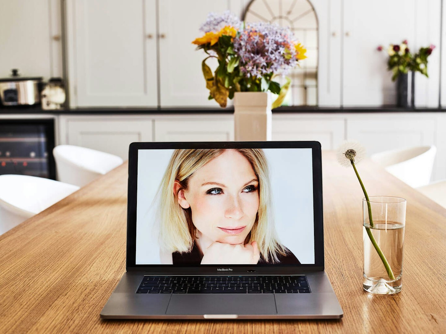 Woman on laptop screen